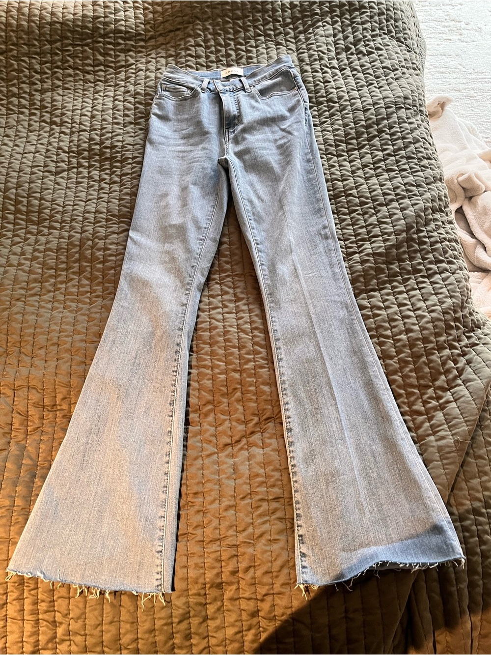 Frame Denim Light Blue Flare Jeans with Raw Hem